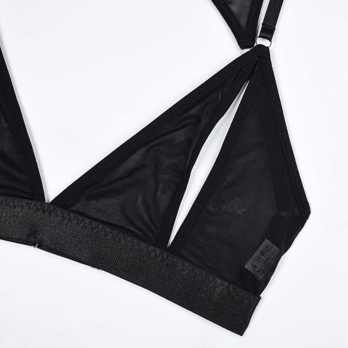 Close-up of black mesh bralette with provocative cutout design