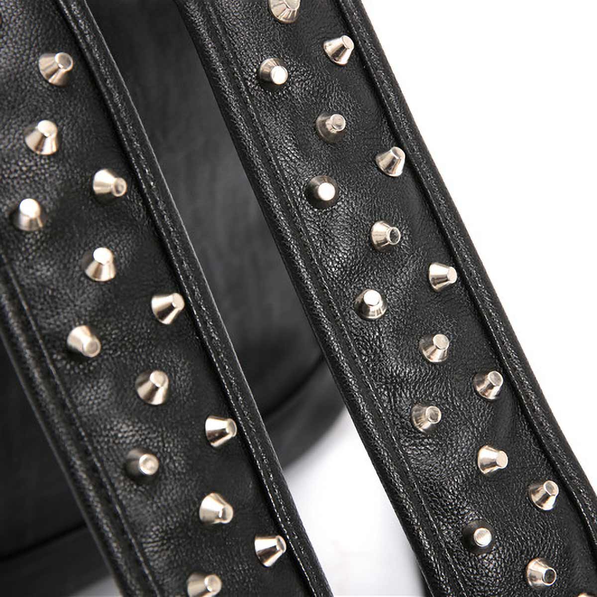 Arcuate shoulder strap detail on alligator pattern punk backpack with spikes