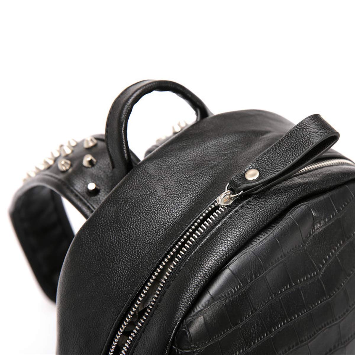 Detailed view of zipper and arcuate strap on edgy black backpack