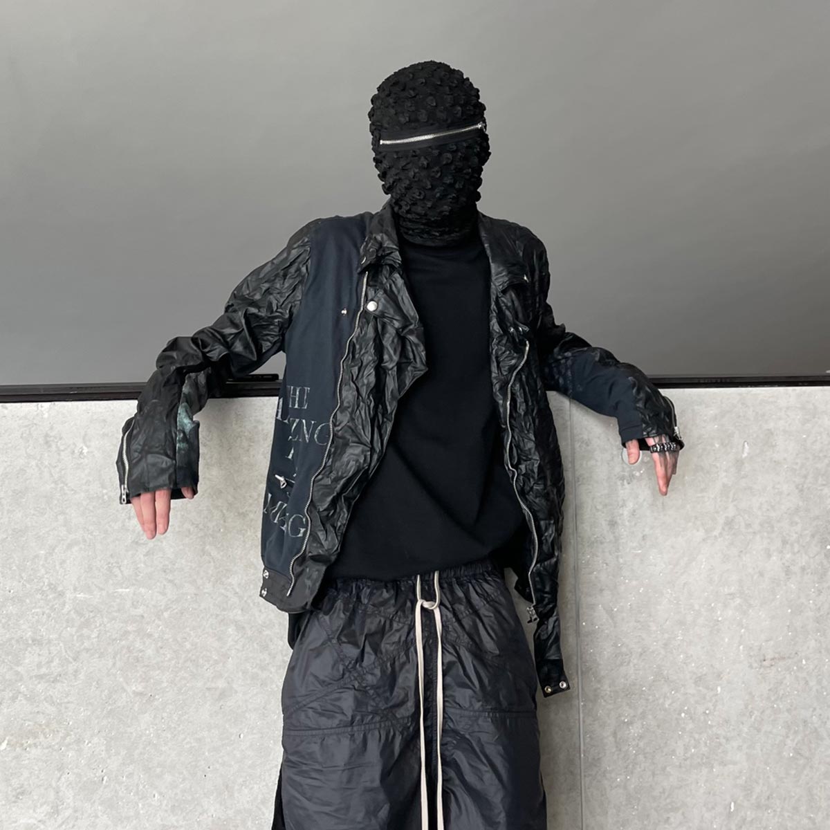 Model wearing Zipper Designer Balaclava at hip hop event, showcasing urban cool look