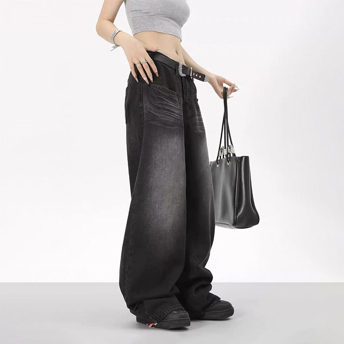 Wide leg baggy jeans with black handbag 90s style side view